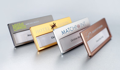 Name badges with metallic surface