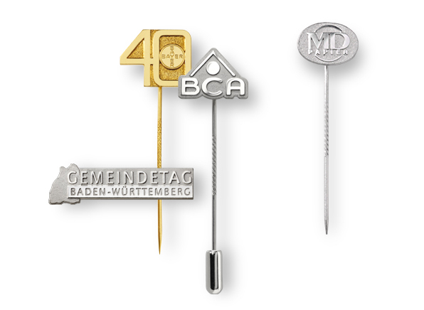 Lapel pins of precious metal embossed