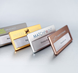 Hotel name badges with metallic finishes